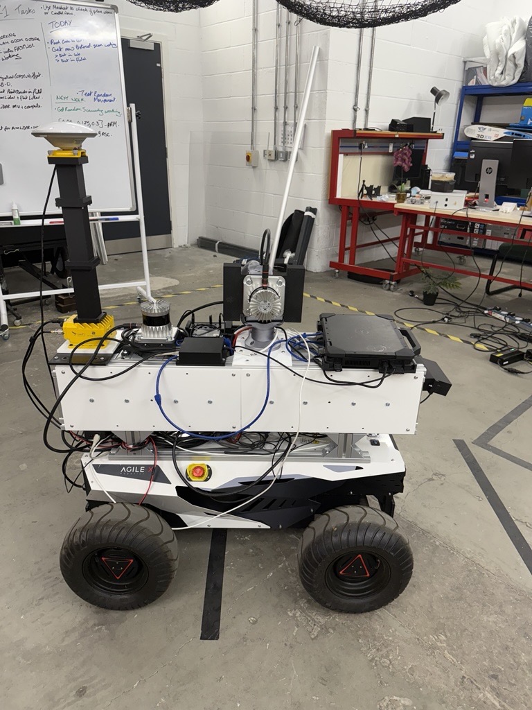 ALFRED from the side with its electronics panels fitted, on the AgileX Hunter 2.0 base